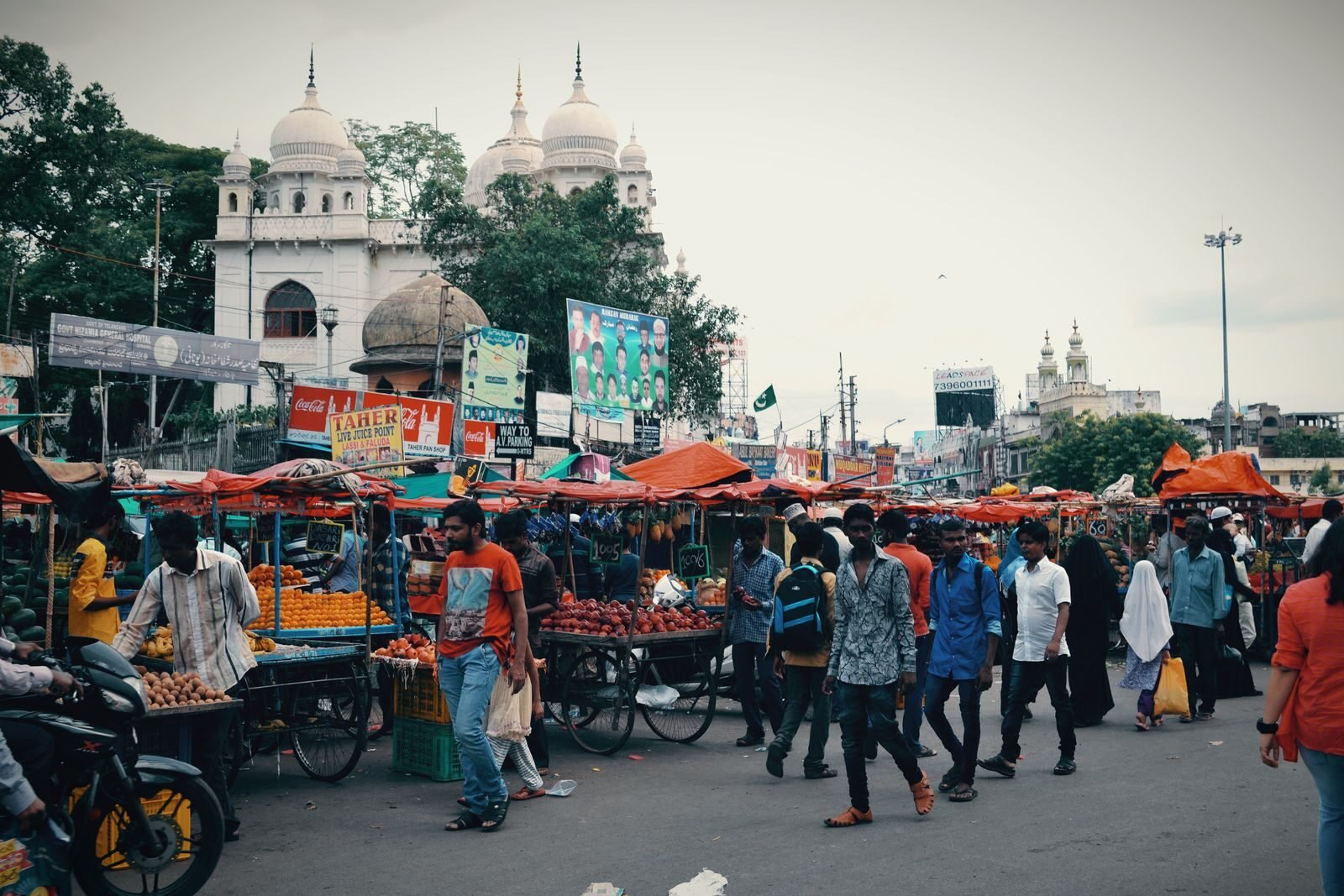 A crowded street lined with market stalls