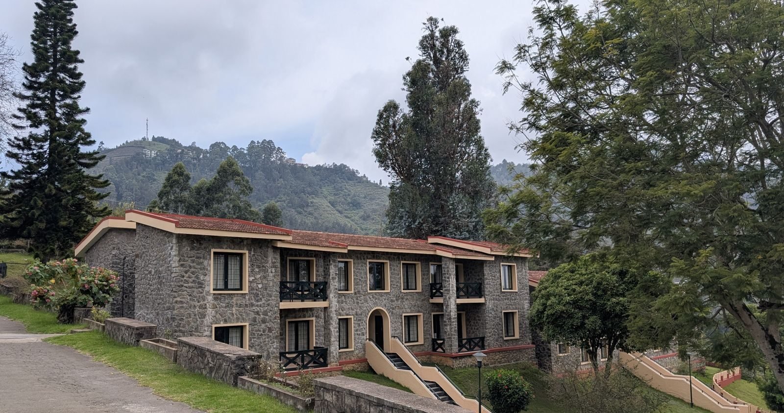 A stone cottage homestay surrounded by greenery in Kodaikanal