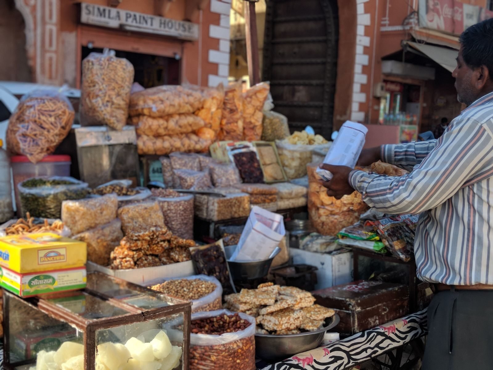 A busy street food stall selling Indian snacks in Jaipur